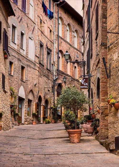 Aerial view of San Gimignano’s medieval towers surrounded by the Tuscan countryside