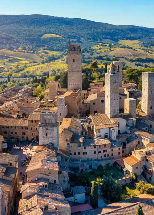Aerial view of San Gimignano’s medieval towers surrounded by the Tuscan countryside